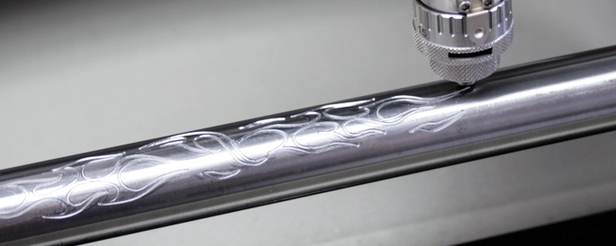 Steel pipe engraved with flames.
